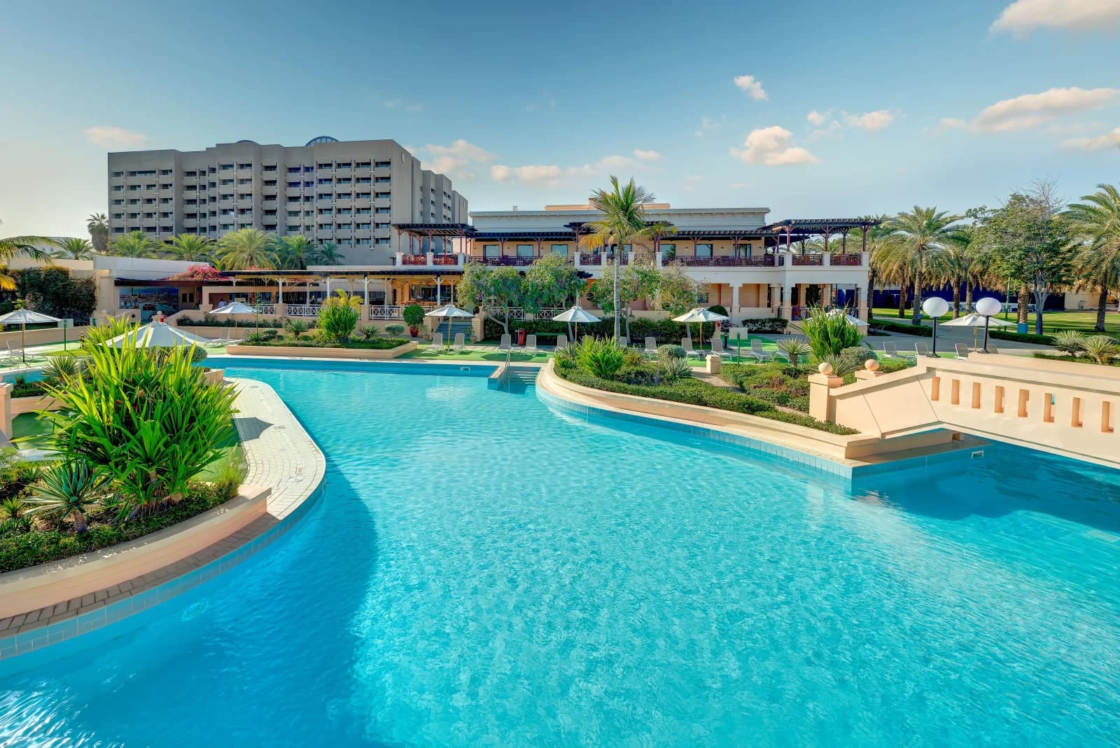 InterContinental Muscat by IHG: The view of the hotel from pool